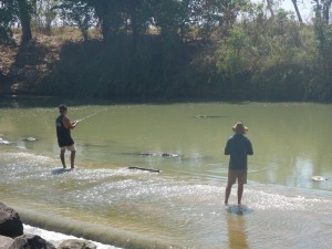 A spot of fishing at Cahill's Crossing, note the crocodile waiting for a catch as well!